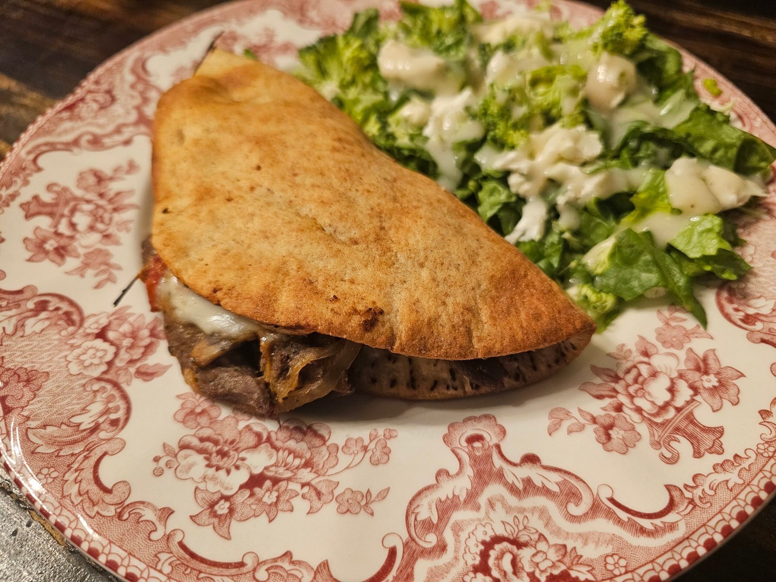Philly cheesesteak chalupas filled with sirloin, peppers, onions, mushrooms, and provolone