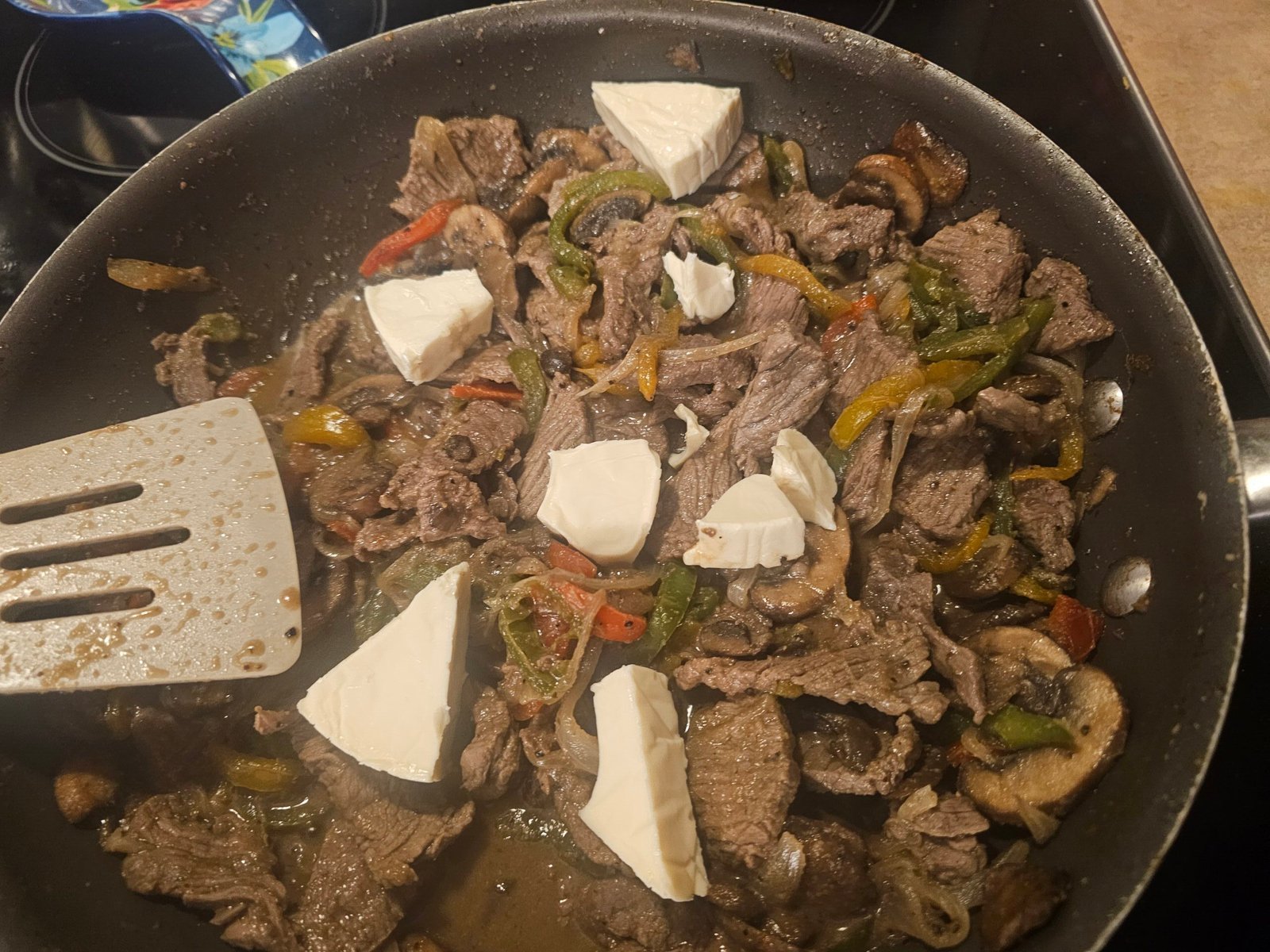 Creamy sirloin, pepper, onion, and mushroom filling for Philly cheesesteak chalupas